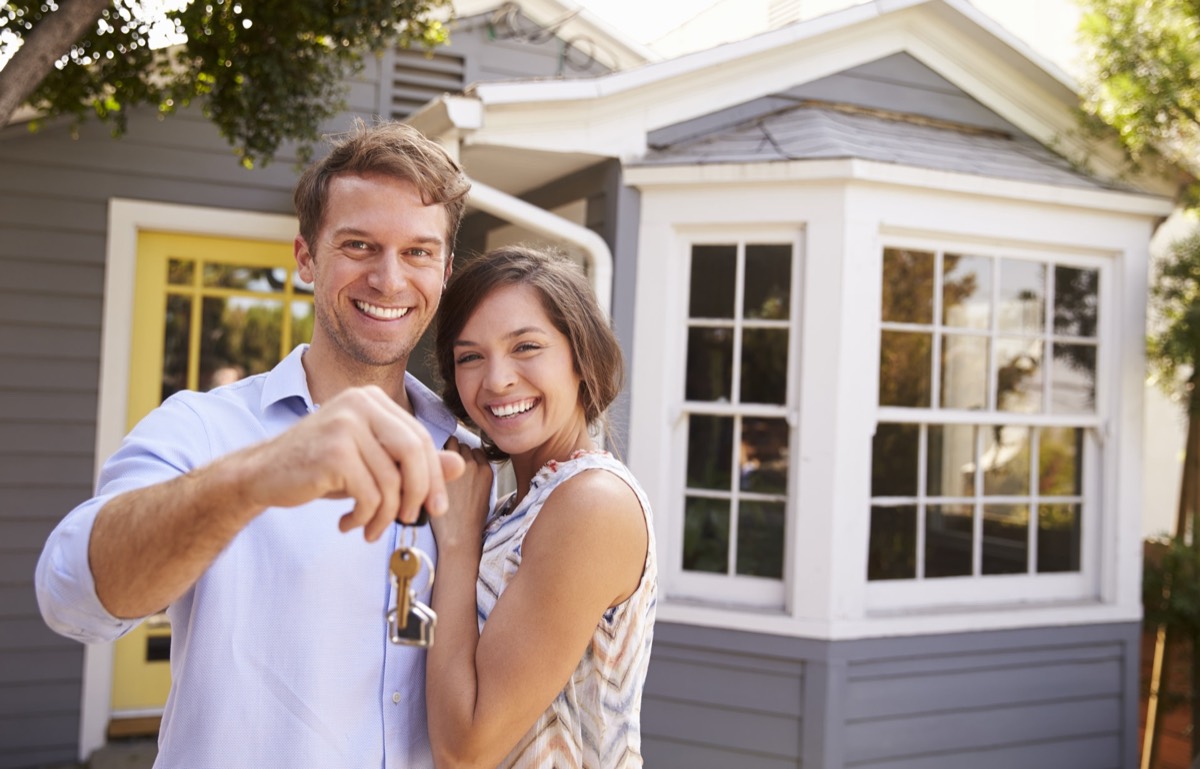 Couple holding the keys to their new home